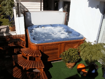 arctic spas hot tub tucked in corner
